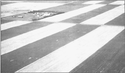 This aerial photo shows a typical pattern of strip farming, with alternating strips of crop and fallow.