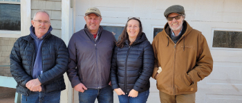 Paul Smallman (middle left) celebrates his win with his wife, Carolyn, Scott (left), and AAFC technician, Roger Henry (right).
